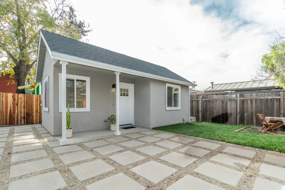 Small grey accessory dwelling unit cottage in California backyard